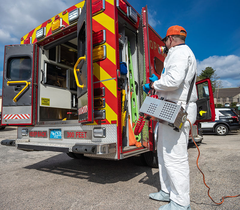 Catseye technician disinfecting a ambulance with Catseye's Viral-Guard service to remove contaminants